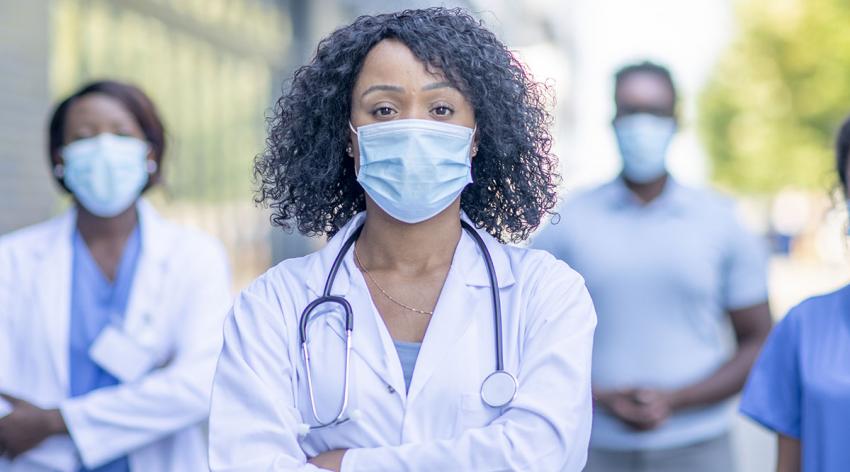 A group of diverse women doctors in masks