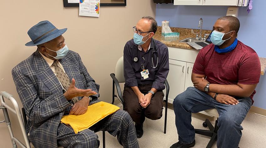 Evan Ashkin, MD, and community health worker Tommy Green (right), who himself spent time in prison, work with a patient in the Formerly Incarcerated Transition Clinic in Chapel Hill, North Carolina. (The patient granted permission to use his image but asked that his name be withheld.)