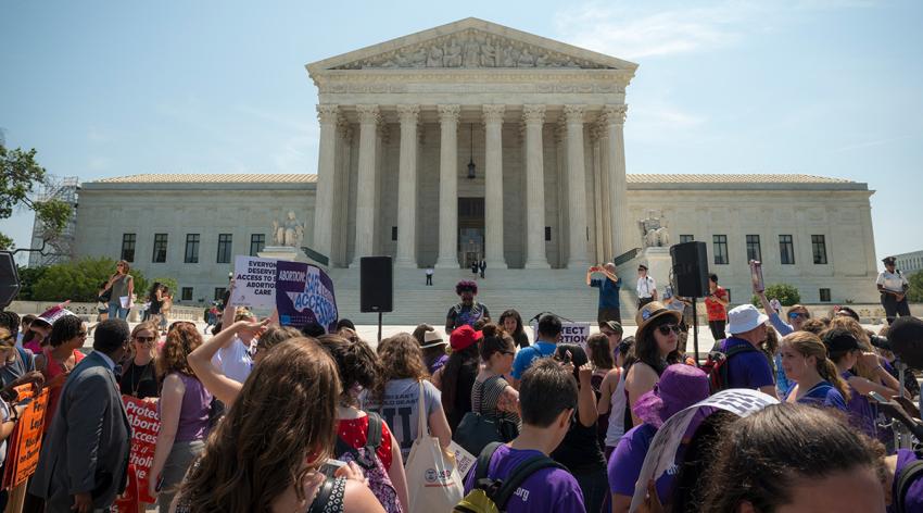 Washington DC, USA - June 27, 2016: Pro-choice supporters stand in front of the U.S. Supreme Court after the court, in a 5-3 ruling in the case Whole Woman's Health v. Hellerstedt, struck down a Texas abortion access law.