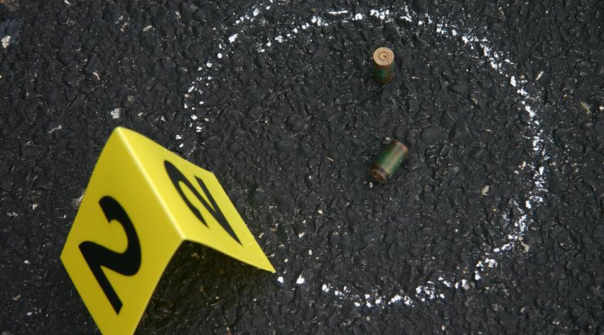 Bullet shell casings marked off at a crime scene