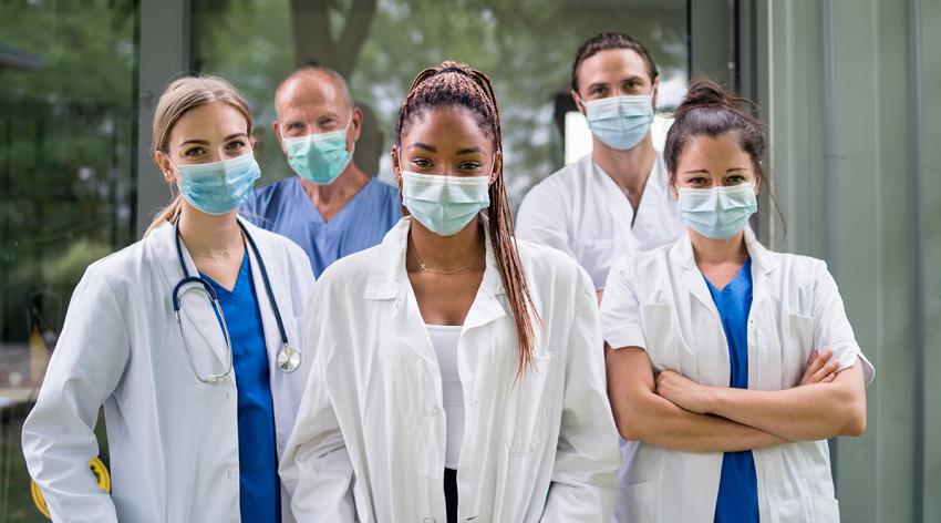 Portrait of doctors with face mask standing