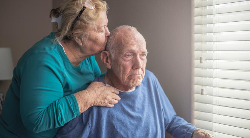 Senior man at home on hospice with wife