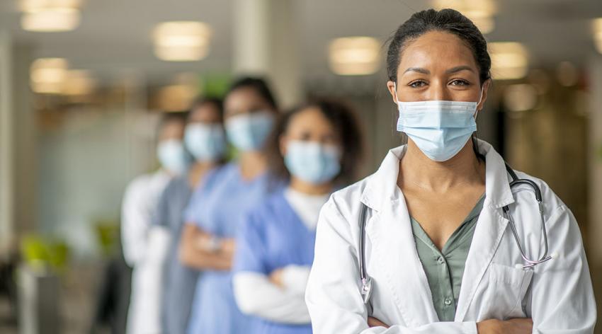 A group of diverse women medical providers with masks