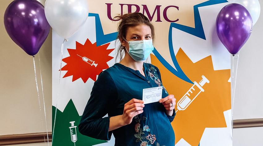 Victoria Heinrich, an MD-PhD student at the University of Pittsburgh, poses after getting her COVID-19 vaccine while 20 weeks pregnant.