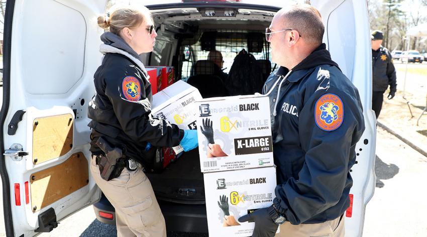 Police in East Meadow, New York, lead a donation drive to collect medical equipment such as N95 surgical masks, nitrile gloves, tyvex suits, and antibacterial and disinfecting wipes to battle the coronavirus pandemic on March 24, 2020