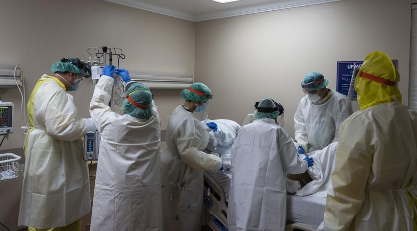 Members of the medical staff at the United Memorial Medical Center in Houston, Texas, treat a patient in the COVID-19 intensive care unit on July 2, 2020