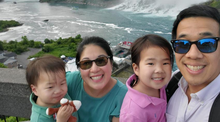 Kam Lam, MD, MPH, a breastfeeding medicine specialist at the Cleveland Clinic, poses with her son Brandon, 1, daughter Natalie, 3, and husband Jason, an orthopedic surgeon at the Cleveland Clinic, at Niagara Falls.
