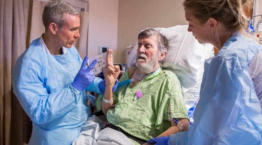 Wes Ely, MD, MPH, performs a cognitive exam on an ICU patient at Vanderbilt University Medical Center in Nashville in 2018.
